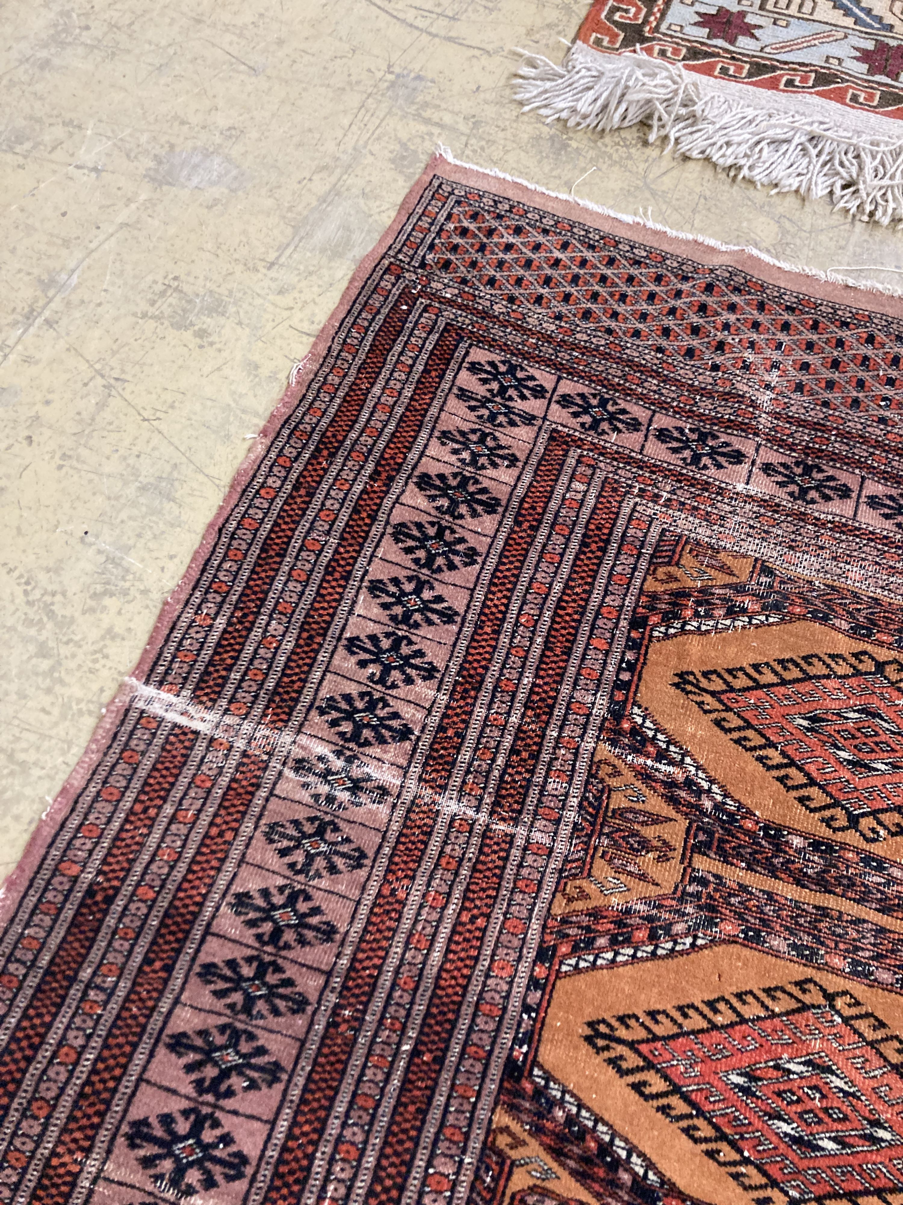 A Bokhara orange ground rug 198 x 125 cms, a smaller Anatolian flat weave rug and Bokhara prayer mat.